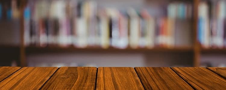 wooden-table-with-library-background